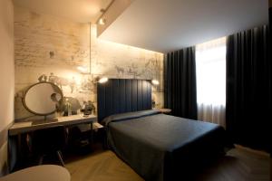Postel nebo postele na pokoji v ubytování Palace Hotel Moderno + 37 fotografií