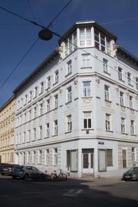 a white building with cars parked in front of it at Vienna4you App 10 you are welcome in Vienna