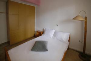 Ένα ή περισσότερα κρεβάτια σε δωμάτιο στο Meltemi