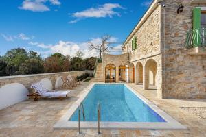 a swimming pool in the backyard of a house at Villa Perina Biograd, something completely different in Biograd na Moru