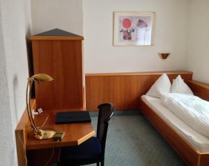 Postel nebo postele na pokoji v ubytování Hotel Ahorni