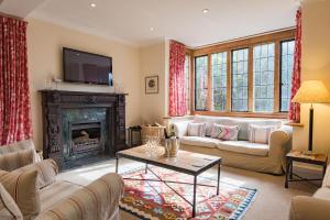 a living room with a couch and a fireplace at Hockley House by Bloom Stays in Folkestone