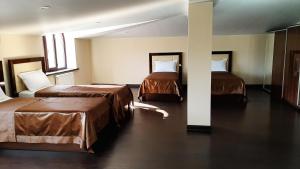 Pamir Palace客房内的一张或多张床位