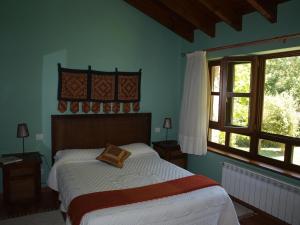 A bed or beds in a room at Bajo Los Tilos