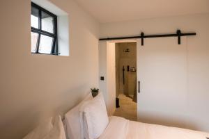 Postel nebo postele na pokoji v ubytování B&B Amelhof