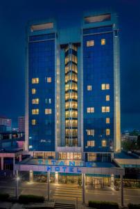 a large building with many windows at night at Titanic Port Bakirkoy in Istanbul