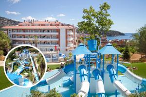 a water park with a water slide in a park at Hotel Gran Garbi & AquaSplash in Lloret de Mar