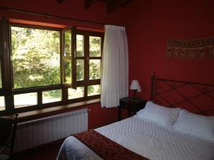 A bed or beds in a room at Bajo Los Tilos