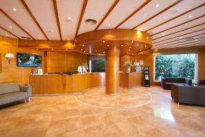 a lobby with a reception desk in a building at Hotel Gran Garbi Mar & AquaSplash in Lloret de Mar +12 photos