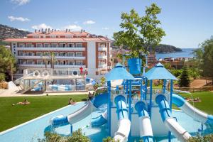 a pool with a water park with a water slide at Hotel Gran Garbi Mar & AquaSplash in Lloret de Mar