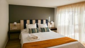 Postel nebo postele na pokoji v ubytování El Guanche Ático