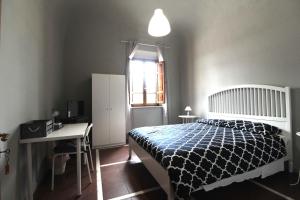 Posteľ alebo postele v izbe v ubytovaní Le Cascine