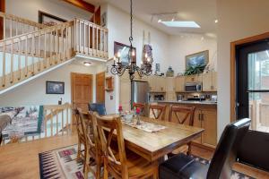 a kitchen and dining room with a wooden table and chairs at Mountain Splendor in Estes Park