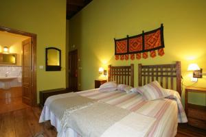 A bed or beds in a room at Bajo Los Tilos