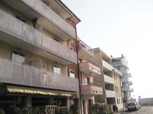 a large building with balconies on the side of it at Villa Al Mare in Grado