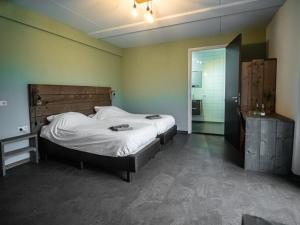Postel nebo postele na pokoji v ubytování B&B bij de 3 linden