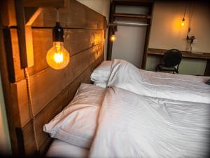 Postel nebo postele na pokoji v ubytování B&B bij de 3 linden