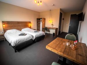 Postel nebo postele na pokoji v ubytování B&B bij de 3 linden