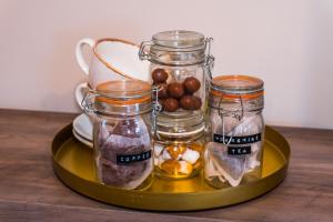 a tray with three jars of food on a table at Exelby Green Dragon in Leeming Bar