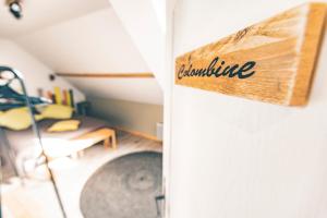 a sign that reads ambulance hanging on a wall at Chambres d'Hôtes les Colombes in Montmort-Lucy