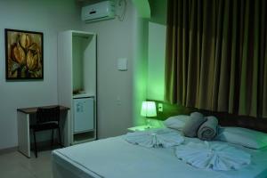 Cama ou camas em um quarto em Tangará Hotel