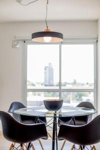 a dining room table with black chairs and a large window at san francisco loft 2 in San Francisco +24 photos
