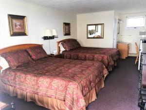 Ένα ή περισσότερα κρεβάτια σε δωμάτιο στο Sandpiper Beachfront Motel