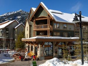 a large wooden house with a ski lodge at Panorama Mountain Resort - Ski Tip / Tamarack Condos in Panorama +26 photos