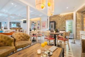 a restaurant with a table and chairs and a dining room at Alcudia Petit - Turismo de Interior in Alcudia
