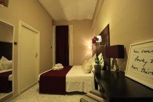Postel nebo postele na pokoji v ubytování Hotel Felice