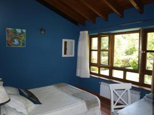 A bed or beds in a room at Bajo Los Tilos