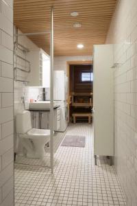 a bathroom with a toilet and a sink at 2ndhomes Deluxe 1BR Kamppi Center Apartment with Sauna and Terrace in Helsinki