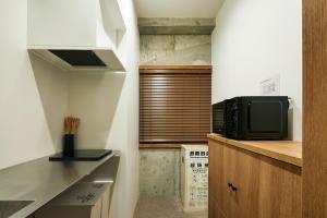 mizuka Nakasu 5 - unmanned hotel -にあるキッチンまたは簡易キッチン