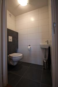 Ett badrum på Appartement Stokroos