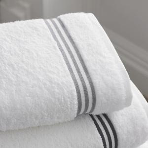 a close up of a stack of white towels at Hotel zur Therme in Erwitte