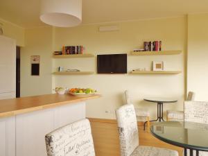 a kitchen and dining room with a table and chairs at Cielo di Taormina in Taormina