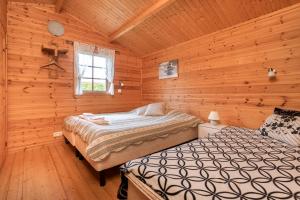 Una cama o camas en una habitación de Sireksstadir Farm Holiday