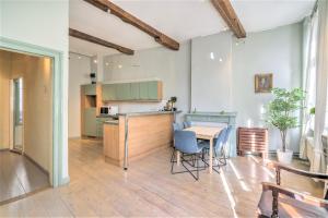 a kitchen and dining room with a table and chairs at The Hendrik House in Old Town Antwerp in Antwerp