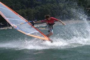 a man is on a sail board in the water at Casa Flora in Crone
