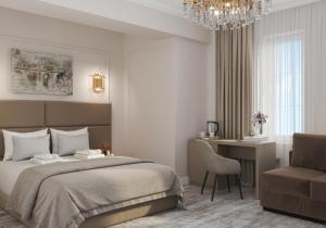 a bedroom with a bed and a desk and a chair at Lumiere Boutique Hotel in Moscow