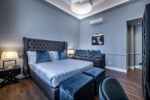 Un pat sau paturi într-o cameră la Hotel Ungherese Small Luxury Hotel