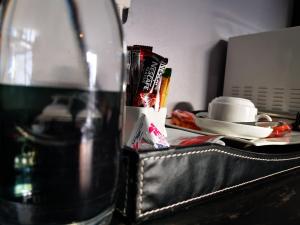 a bottle of water sitting on top of a table at Green Olive Residences in Bethlehem