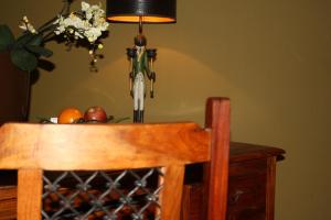 a table with a lamp and a table with fruit on it at Art Hotel Neckar in Neckargemünd