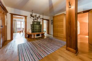 a large living room with a fireplace and a table at Haus Andrea Unterberger in Flachau