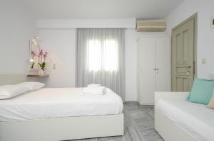 Ένα ή περισσότερα κρεβάτια σε δωμάτιο στο Soula Naxos