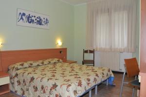 Ένα ή περισσότερα κρεβάτια σε δωμάτιο στο Casa Lucia 1