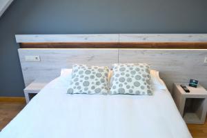 Postel nebo postele na pokoji v ubytování Hotel Alda Centro Oviedo