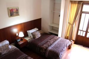 Postel nebo postele na pokoji v ubytování Rio Hotel