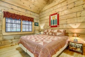 a bedroom with a bed in a log cabin at A Bear Pause in Blue Ridge