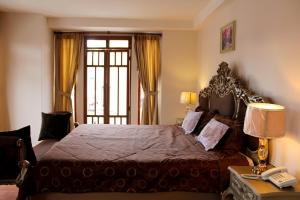 Postel nebo postele na pokoji v ubytování Rio Hotel
